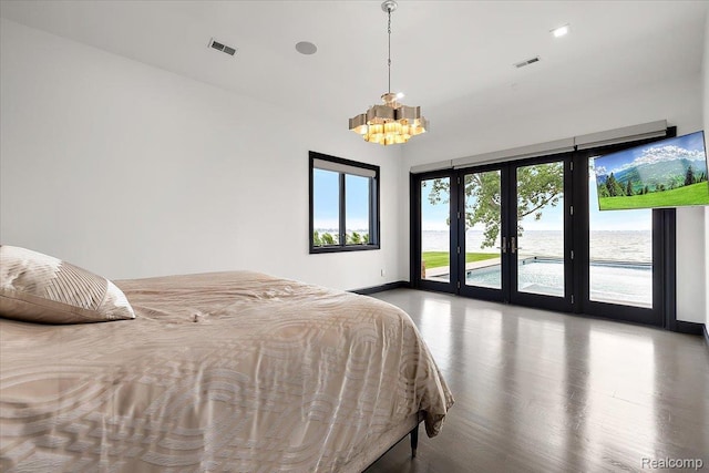8349 Dixie Hwy, Ira, MI 48023 - bedroom featuring a chandelier, access to exterior, and wood finished floors
