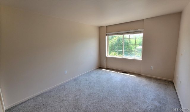157 E Bay Dr, Walled Lake, MI 48390 - carpeted spare room with baseboards