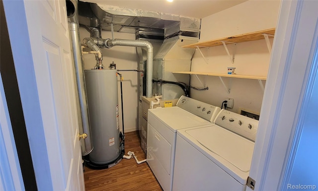 157 E Bay Dr, Walled Lake, MI 48390 - laundry area featuring water heater, washer and clothes dryer, and wood finished floors