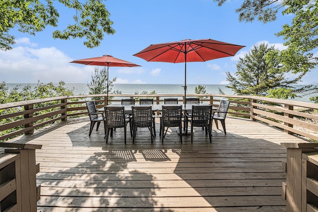 8641 N Perry Ave, Pentwater, MI 49449 - deck with outdoor dining space and a water view