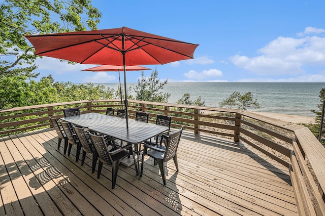 8641 N Perry Ave, Pentwater, MI 49449 - wooden terrace featuring a water view and outdoor dining space