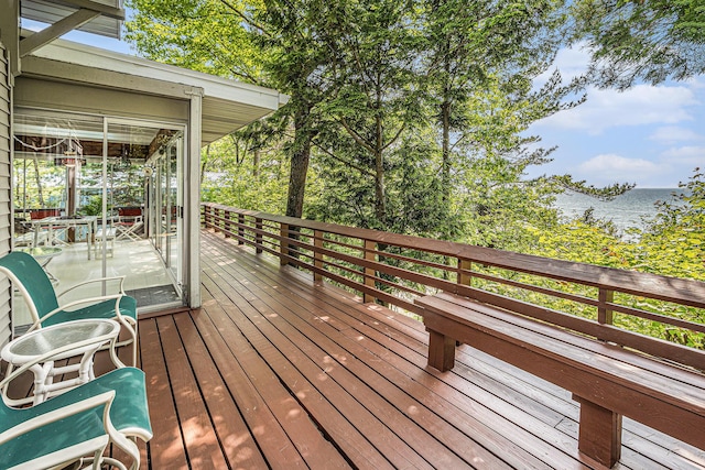 8641 N Perry Ave, Pentwater, MI 49449 - wooden terrace featuring a water view