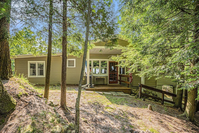 8641 N Perry Ave, Pentwater, MI 49449 - rear view of house with covered porch