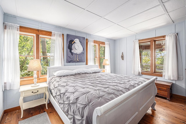 8641 N Perry Ave, Pentwater, MI 49449 - bedroom featuring wood finished floors and baseboards