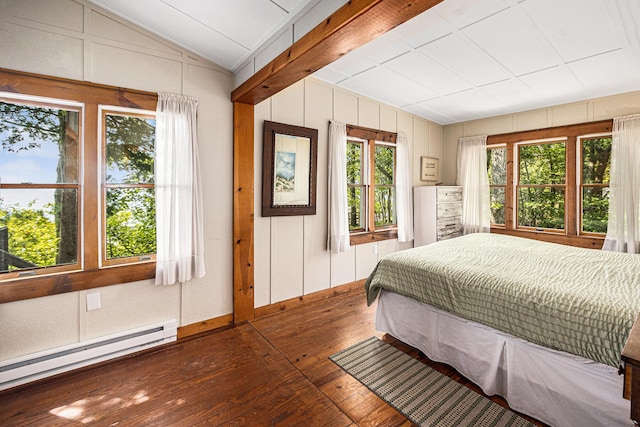 8641 N Perry Ave, Pentwater, MI 49449 - bedroom featuring baseboard heating, wood-type flooring, a water view, and wooden walls