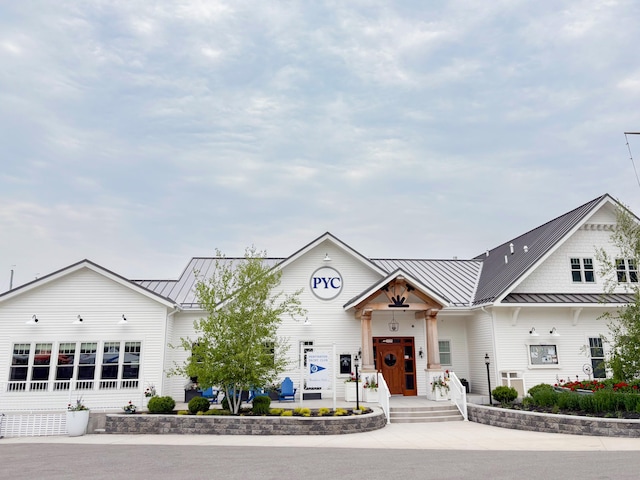 8641 N Perry Ave, Pentwater, MI 49449 - view of front of property with a standing seam roof and a metal roof