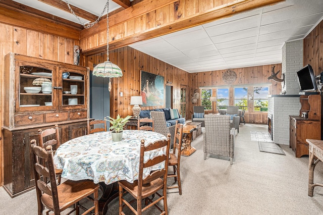 8641 N Perry Ave, Pentwater, MI 49449 - dining space with wood walls and light carpet