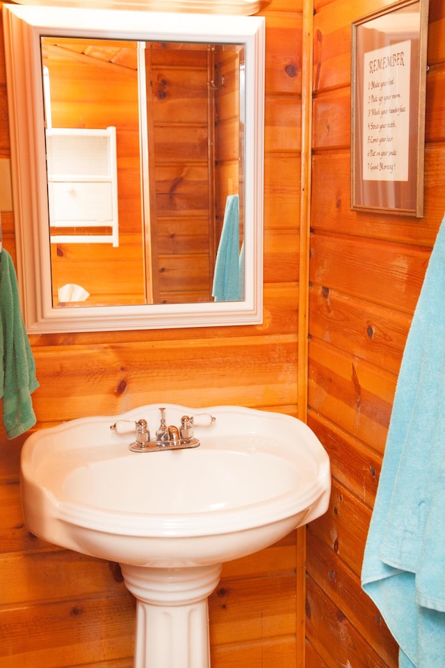 8641 N Perry Ave, Pentwater, MI 49449 - bathroom featuring wood walls