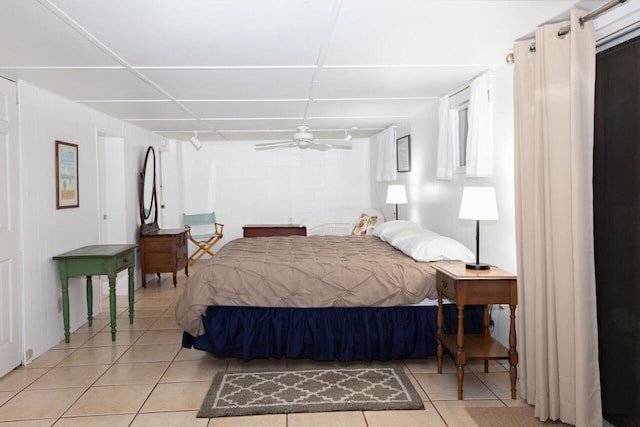 8641 N Perry Ave, Pentwater, MI 49449 - bedroom featuring light tile patterned floors and ceiling fan