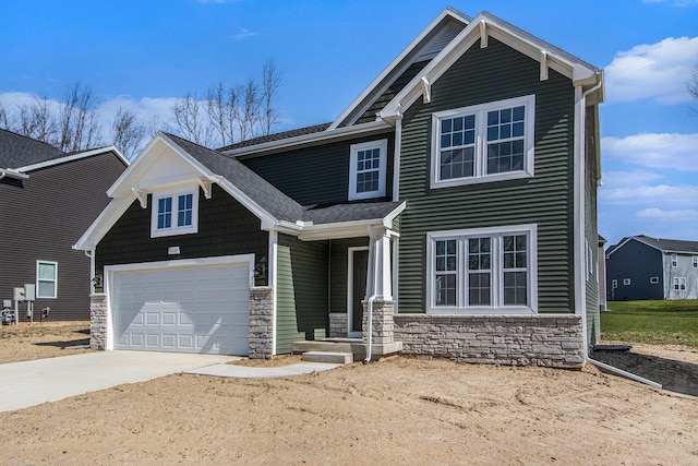 5698 Landrum Trl, Portage, MI 49024 - view of front of house with stone siding and concrete driveway