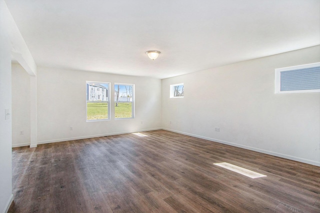5698 Landrum Trl, Portage, MI 49024 - spare room featuring dark wood-type flooring and baseboards