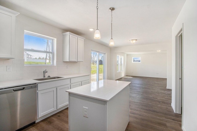 5698 Landrum Trl, Portage, MI 49024 - kitchen with dishwasher, tasteful backsplash, a kitchen island, dark wood-type flooring, and white cabinetry