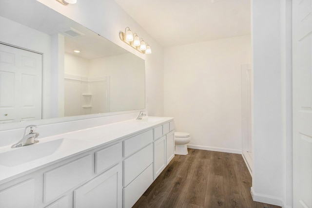 5698 Landrum Trl, Portage, MI 49024 - full bathroom featuring double vanity and wood finished floors