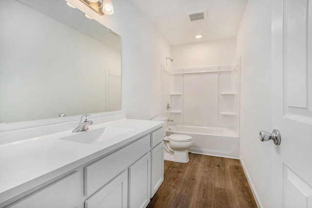 5698 Landrum Trl, Portage, MI 49024 - bathroom with vanity, wood finished floors, and tub / shower combination