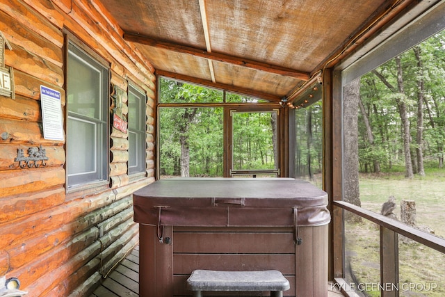 9210/9228 S Star Lake Dr, Baldwin, MI 49304 - sunroom / solarium featuring a jacuzzi, healthy amount of natural light, and lofted ceiling