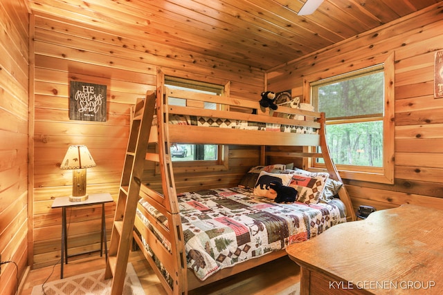 9210/9228 S Star Lake Dr, Baldwin, MI 49304 - bedroom with wood walls, wood finished floors, and wooden ceiling