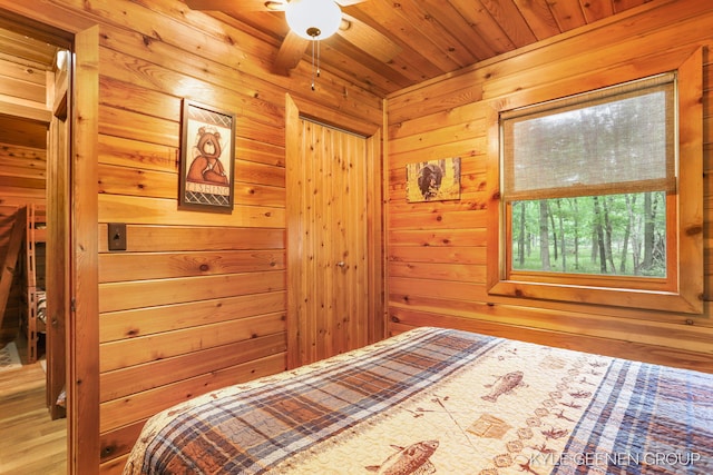 9210/9228 S Star Lake Dr, Baldwin, MI 49304 - bedroom featuring a relaxing sauna, wood walls, and wood ceiling
