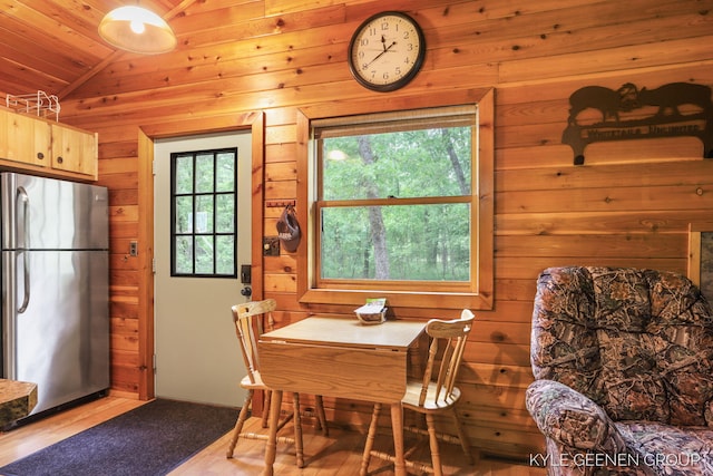 9210/9228 S Star Lake Dr, Baldwin, MI 49304 - dining space featuring vaulted ceiling, wooden walls, and wood ceiling