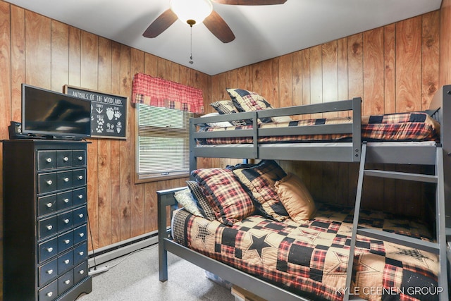 9210/9228 S Star Lake Dr, Baldwin, MI 49304 - bedroom featuring baseboard heating, wood walls, and carpet