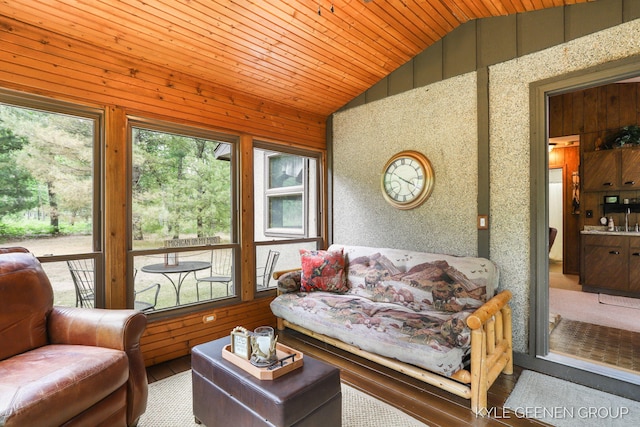 9210/9228 S Star Lake Dr, Baldwin, MI 49304 - living room featuring lofted ceiling, wooden ceiling, wood finished floors, and wood walls