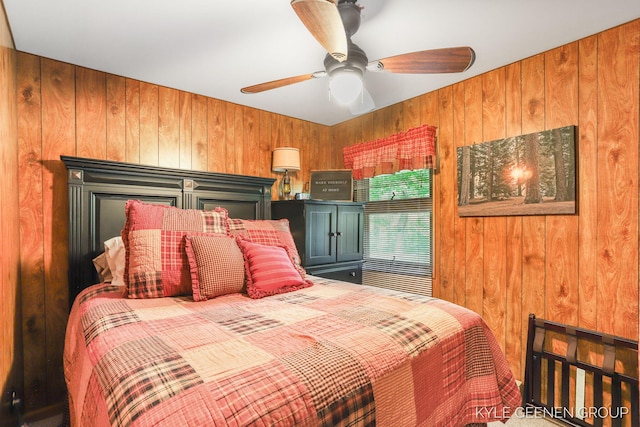 9210/9228 S Star Lake Dr, Baldwin, MI 49304 - bedroom with wooden walls, a ceiling fan, and carpet flooring