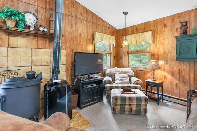 9210/9228 S Star Lake Dr, Baldwin, MI 49304 - carpeted living room with vaulted ceiling, wooden walls, and a baseboard heating unit