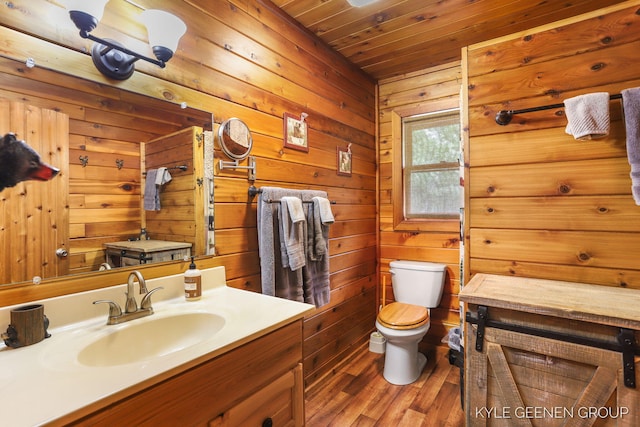 9210/9228 S Star Lake Dr, Baldwin, MI 49304 - bathroom featuring vanity, wooden walls, wood finished floors, and wood ceiling