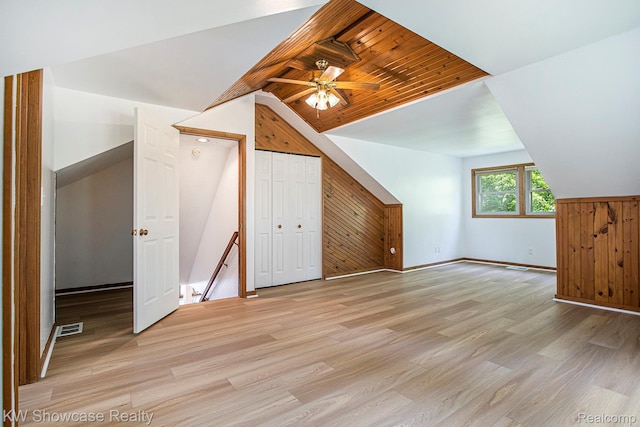 332 Community Dr, Battle Creek, MI 49014 - additional living space with lofted ceiling, light wood-style flooring, wood walls, and ceiling fan