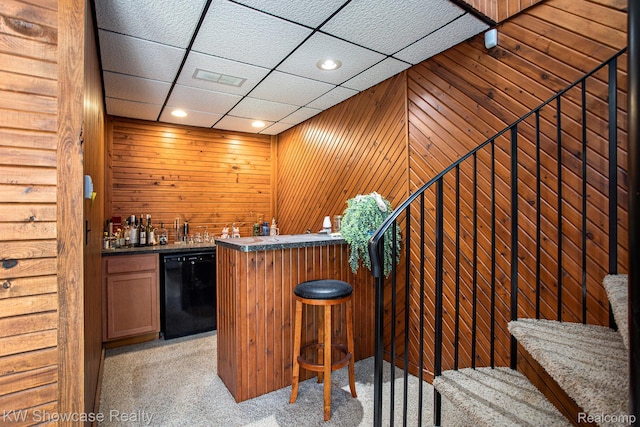 332 Community Dr, Battle Creek, MI 49014 - indoor wet bar with dishwasher, light carpet, wooden walls, a drop ceiling, and recessed lighting