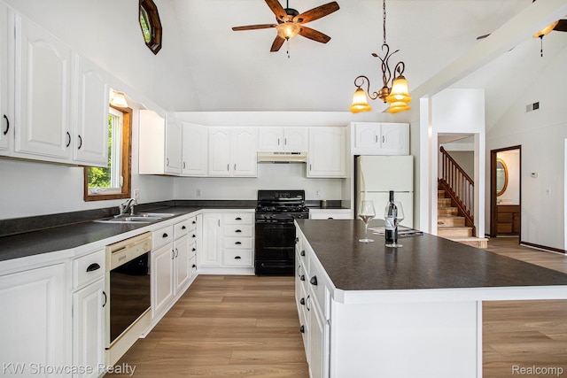 332 Community Dr, Battle Creek, MI 49014 - kitchen featuring black appliances, under cabinet range hood, dark countertops, a ceiling fan, and white cabinets