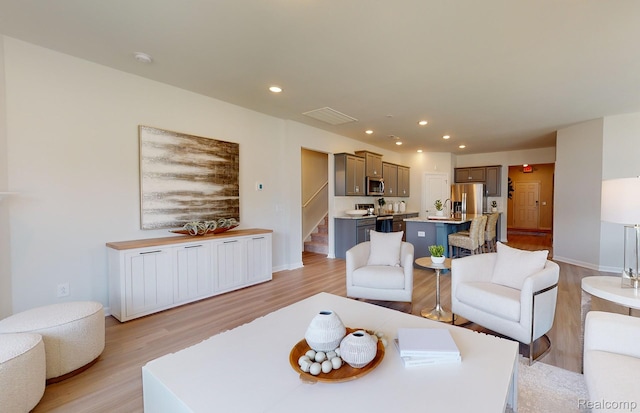 50260 Cromwell St, Canton, MI 48188 - living room with light wood-style flooring, stairs, and recessed lighting