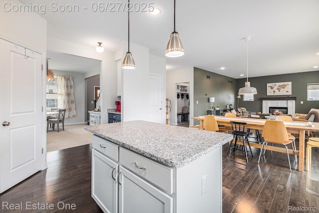 367 Otter Run Rd, Holly, MI 48442 - kitchen with dark wood-style floors, open floor plan, a kitchen island, recessed lighting, and hanging light fixtures