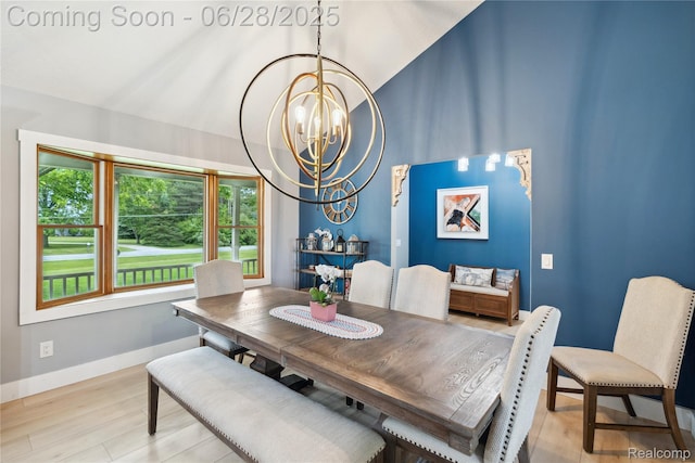 11852 Rathbun Rd, Birch Run, MI 48415 - dining space with a chandelier, plenty of natural light, light wood-style floors, and vaulted ceiling
