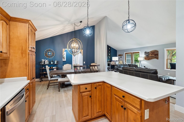 11852 Rathbun Rd, Birch Run, MI 48415 - kitchen featuring stainless steel dishwasher, vaulted ceiling, a chandelier, light countertops, and hanging light fixtures