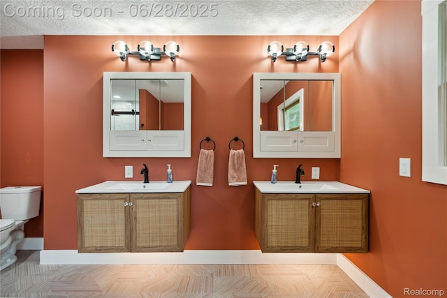 11852 Rathbun Rd, Birch Run, MI 48415 - bathroom with a textured ceiling and two vanities