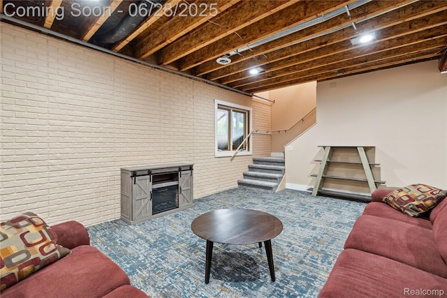 11852 Rathbun Rd, Birch Run, MI 48415 - carpeted living room featuring stairway and brick wall