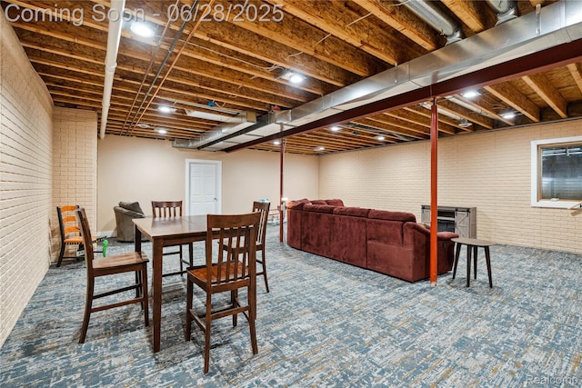 11852 Rathbun Rd, Birch Run, MI 48415 - dining area with brick wall and carpet floors