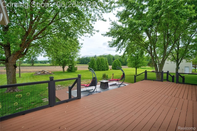 11852 Rathbun Rd, Birch Run, MI 48415 - wooden terrace with an outdoor fire pit and a lawn