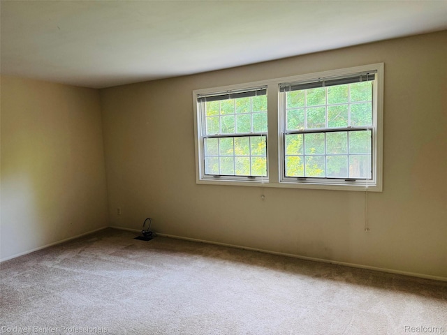 5378 Breeze Hill Pl Apt 32, Troy, MI 48098 - empty room featuring carpet floors and baseboards