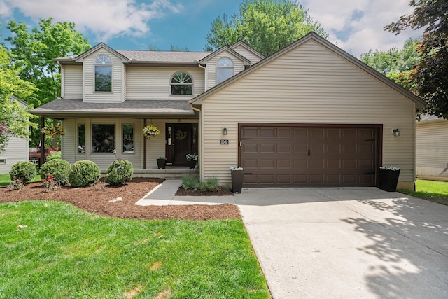 2062 Wildwood Trl, Saline, MI 48176 - traditional-style house featuring driveway, an attached garage, a porch, and a front lawn