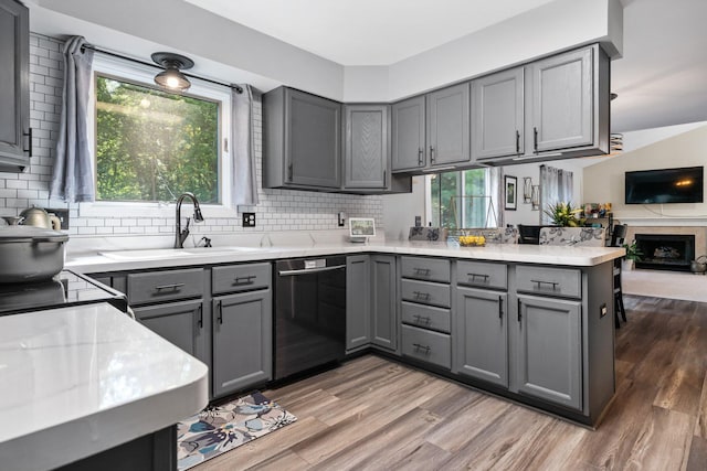 2062 Wildwood Trl, Saline, MI 48176 - kitchen with dishwasher, gray cabinets, and a peninsula