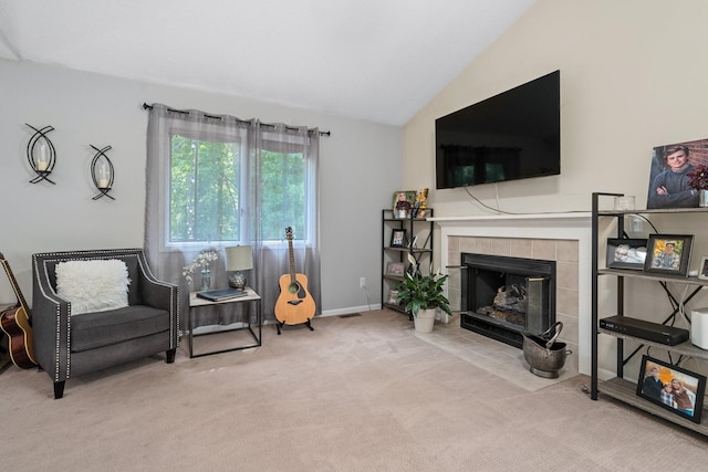 2062 Wildwood Trl, Saline, MI 48176 - sitting room featuring carpet, vaulted ceiling, and a tile fireplace