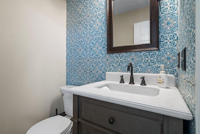 2062 Wildwood Trl, Saline, MI 48176 - half bathroom featuring wallpapered walls and vanity