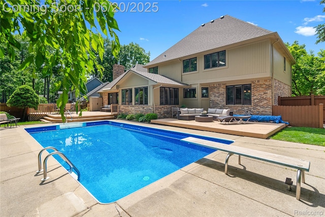 1484 Kings Pointe Rd, Grand Blanc, MI 48439 - view of swimming pool featuring a deck, an outdoor living space, a sunroom, and a diving board