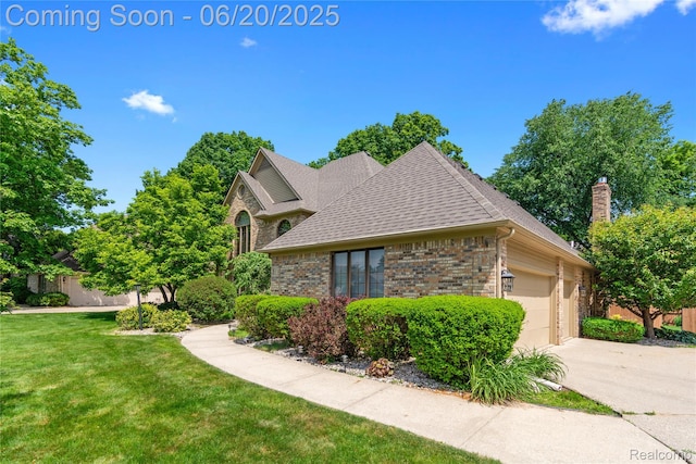 1484 Kings Pointe Rd, Grand Blanc, MI 48439 - view of property exterior with brick siding, roof with shingles, driveway, a garage, and a chimney
