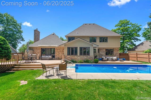 1484 Kings Pointe Rd, Grand Blanc, MI 48439 - view of swimming pool with outdoor lounge area and a wooden deck