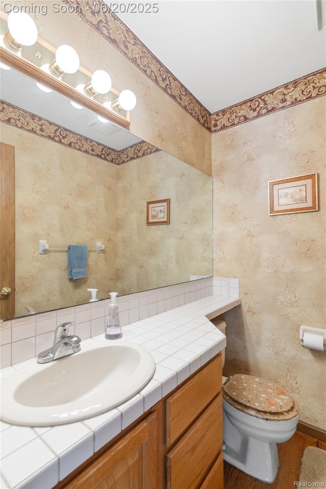 1484 Kings Pointe Rd, Grand Blanc, MI 48439 - half bath featuring vanity and wood finished floors