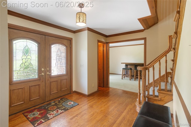 1484 Kings Pointe Rd, Grand Blanc, MI 48439 - entrance foyer with light wood finished floors, stairs, and crown molding