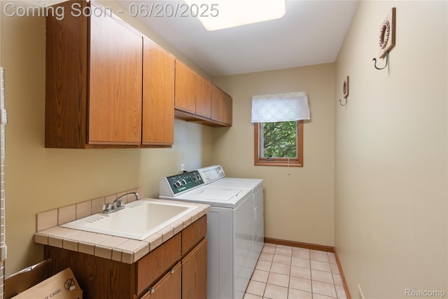 1484 Kings Pointe Rd, Grand Blanc, MI 48439 - laundry room featuring cabinet space, independent washer and dryer, and light tile patterned floors
