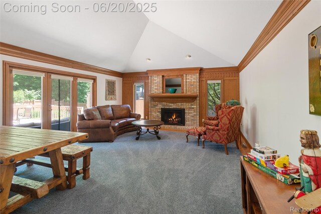1484 Kings Pointe Rd, Grand Blanc, MI 48439 - carpeted living room featuring a fireplace, vaulted ceiling, french doors, and ornamental molding
